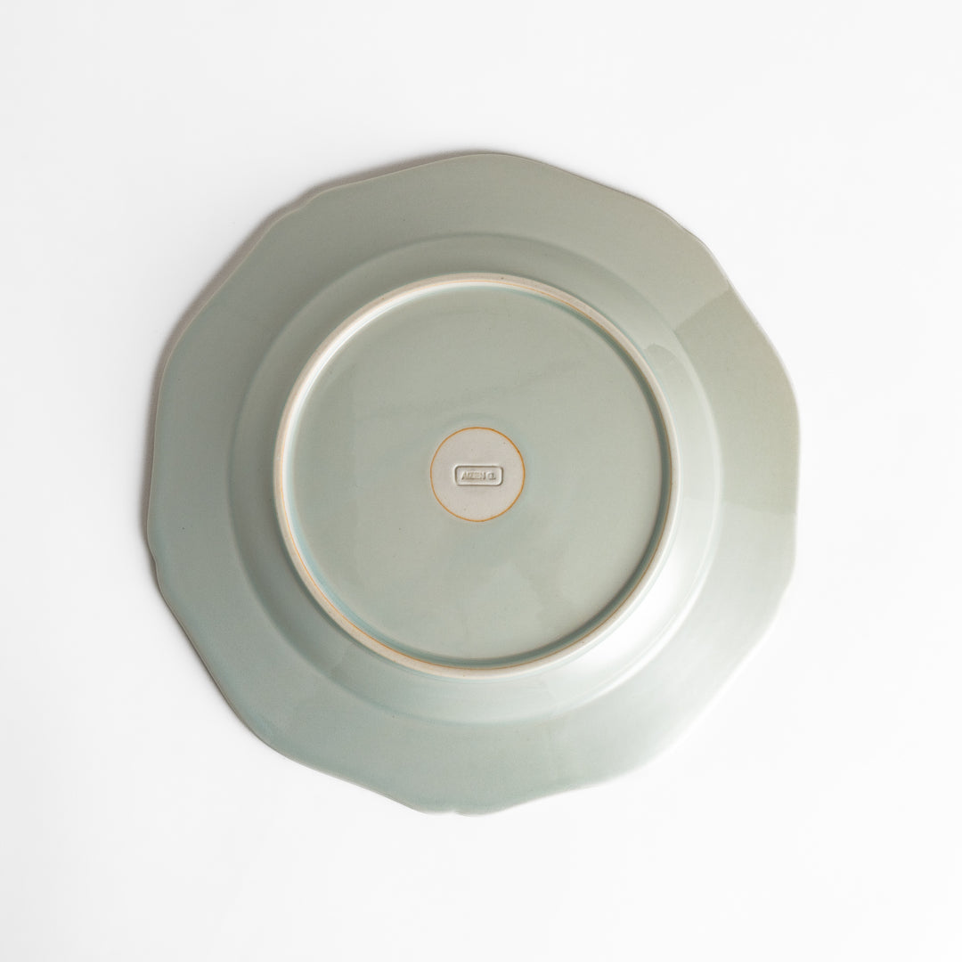 Pretty white dinner plate with a delicate scalloped edge, ideal for showcasing your culinary creations.