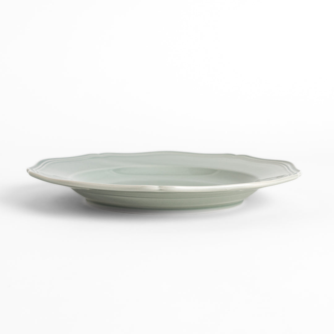 Pretty gray dinner plate with a delicate scalloped edge, ideal for showcasing your culinary creations.