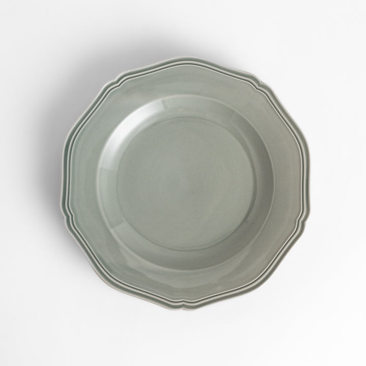 Pretty gray dinner plate with a delicate scalloped edge, ideal for showcasing your culinary creations.