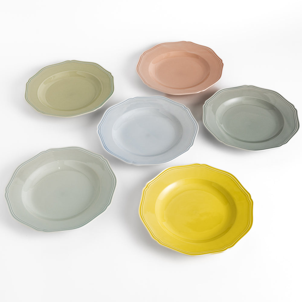 Pretty pastel dinner plates featuring a unique scalloped design, ideal for everyday dining or special occasions.