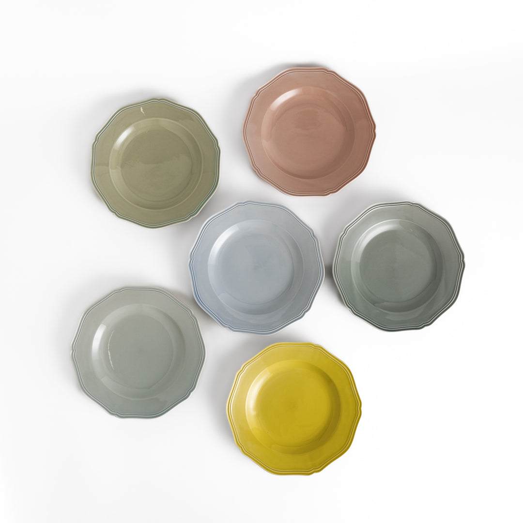 Pretty pastel dinner plates featuring a unique scalloped design, ideal for everyday dining or special occasions.