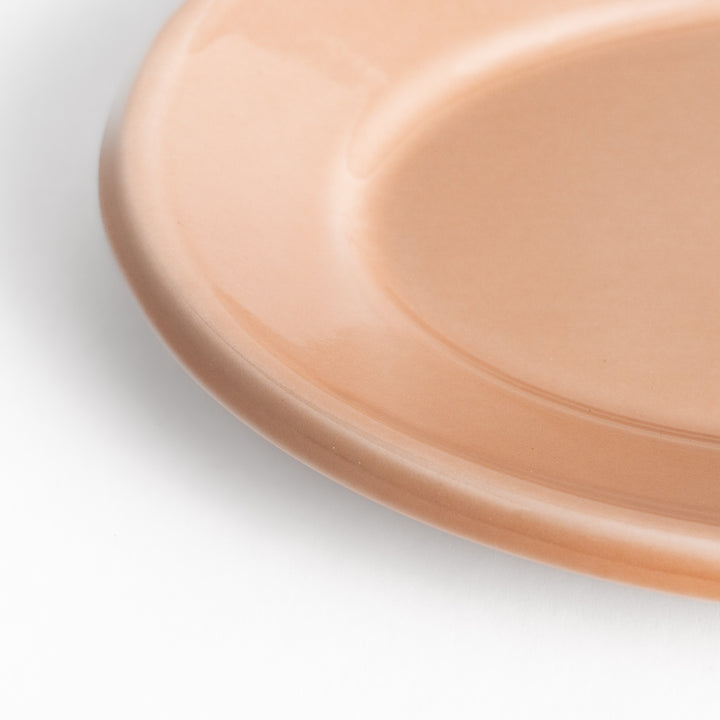 Durable and elegant pink ceramic dessert plate, adding a pop of color to your table setting.