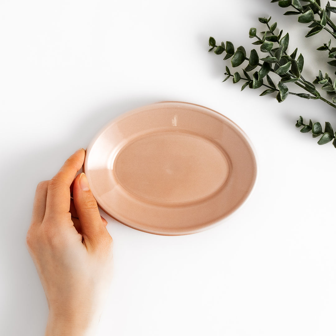 Durable and elegant pink ceramic dessert plate, adding a pop of color to your table setting.