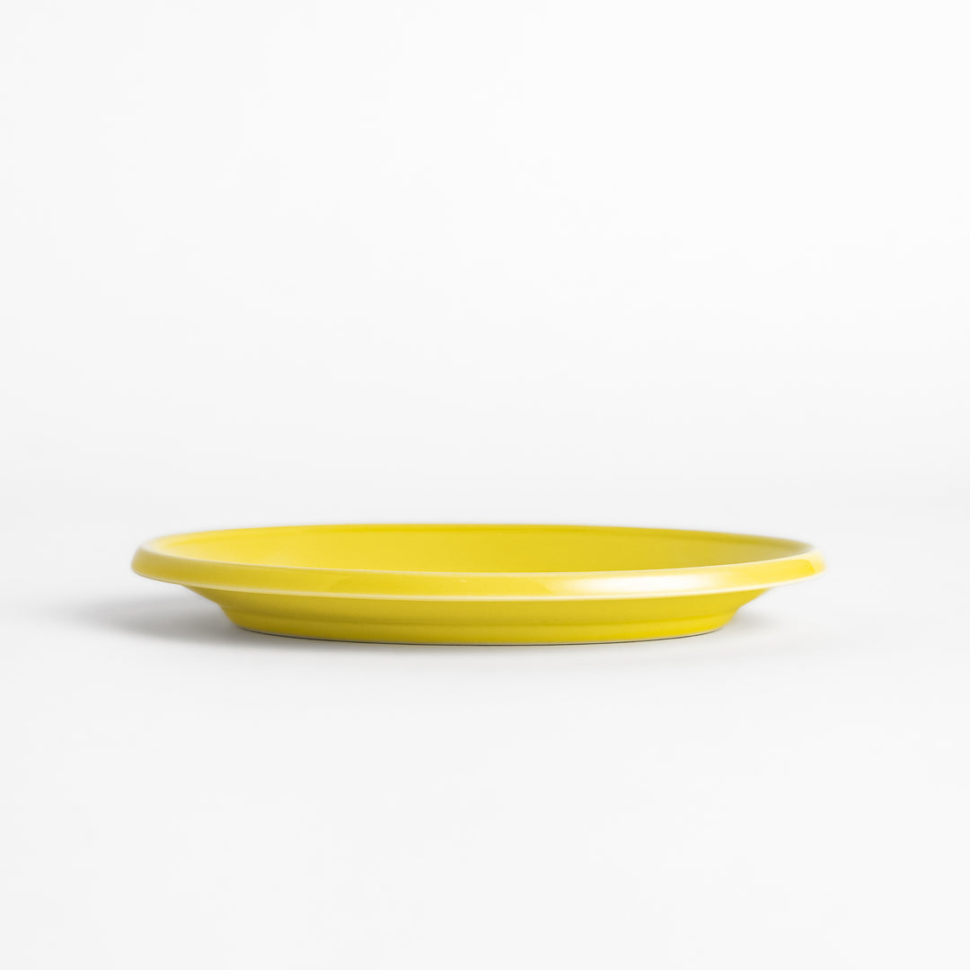 Durable and elegant yellow ceramic dessert plate, adding a pop of sunshine to your table setting.