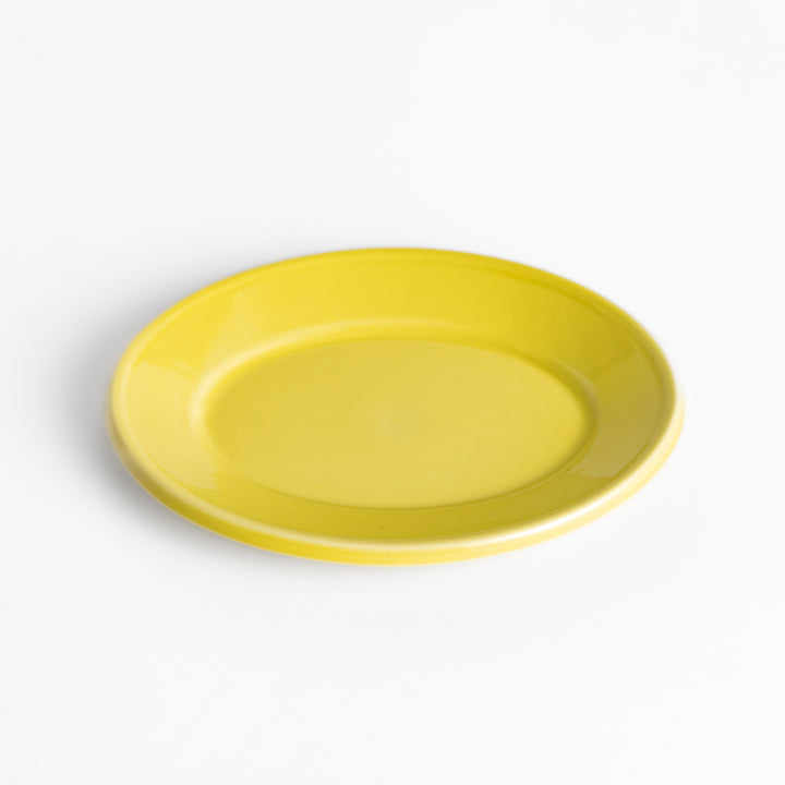 Durable and elegant yellow ceramic dessert plate, adding a pop of sunshine to your table setting.