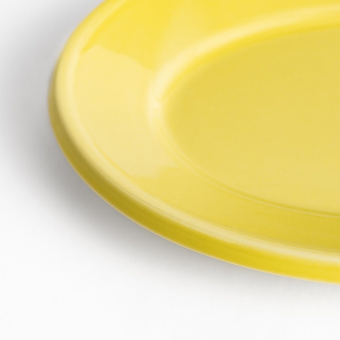 Durable and elegant yellow ceramic dessert plate, adding a pop of sunshine to your table setting.