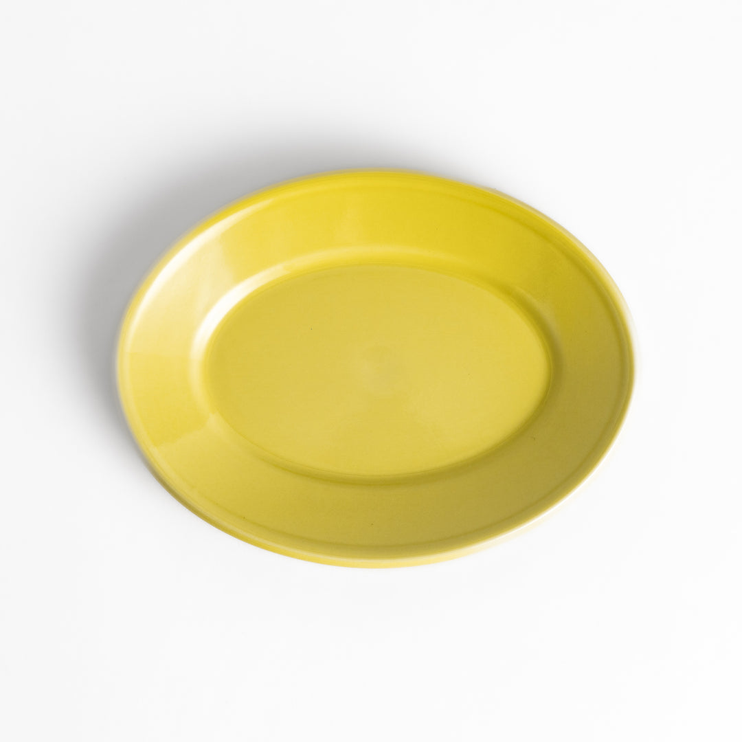 Durable and elegant yellow ceramic dessert plate, adding a pop of sunshine to your table setting.