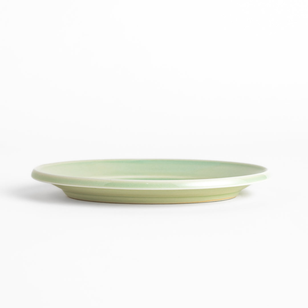 Durable and elegant green ceramic dessert plate, bringing a fresh touch to your table setting.