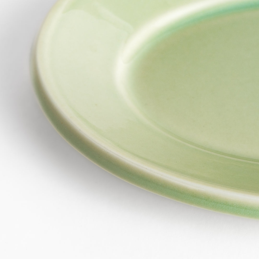 Durable and elegant green ceramic dessert plate, bringing a fresh touch to your table setting.