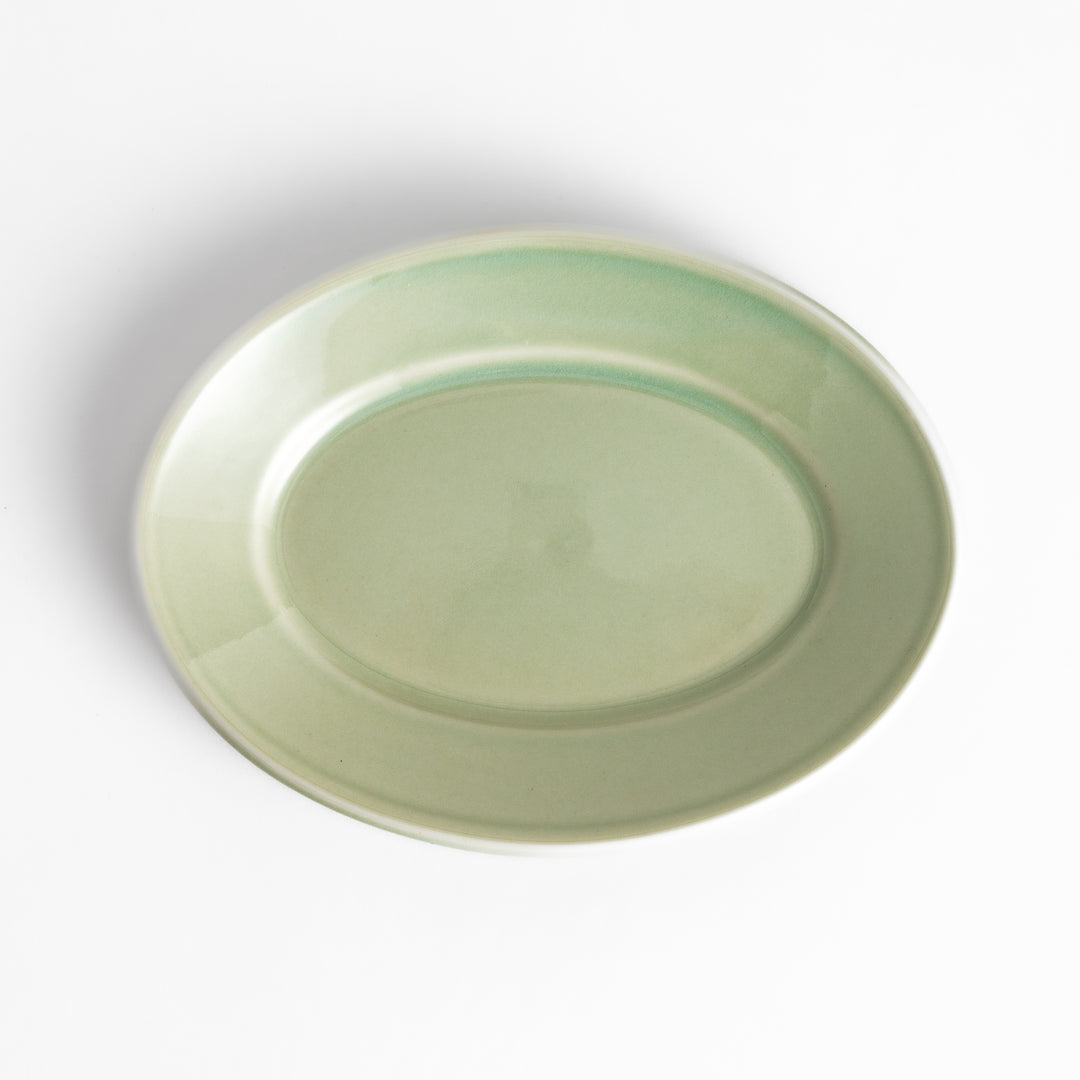 Durable and elegant green ceramic dessert plate, bringing a fresh touch to your table setting.