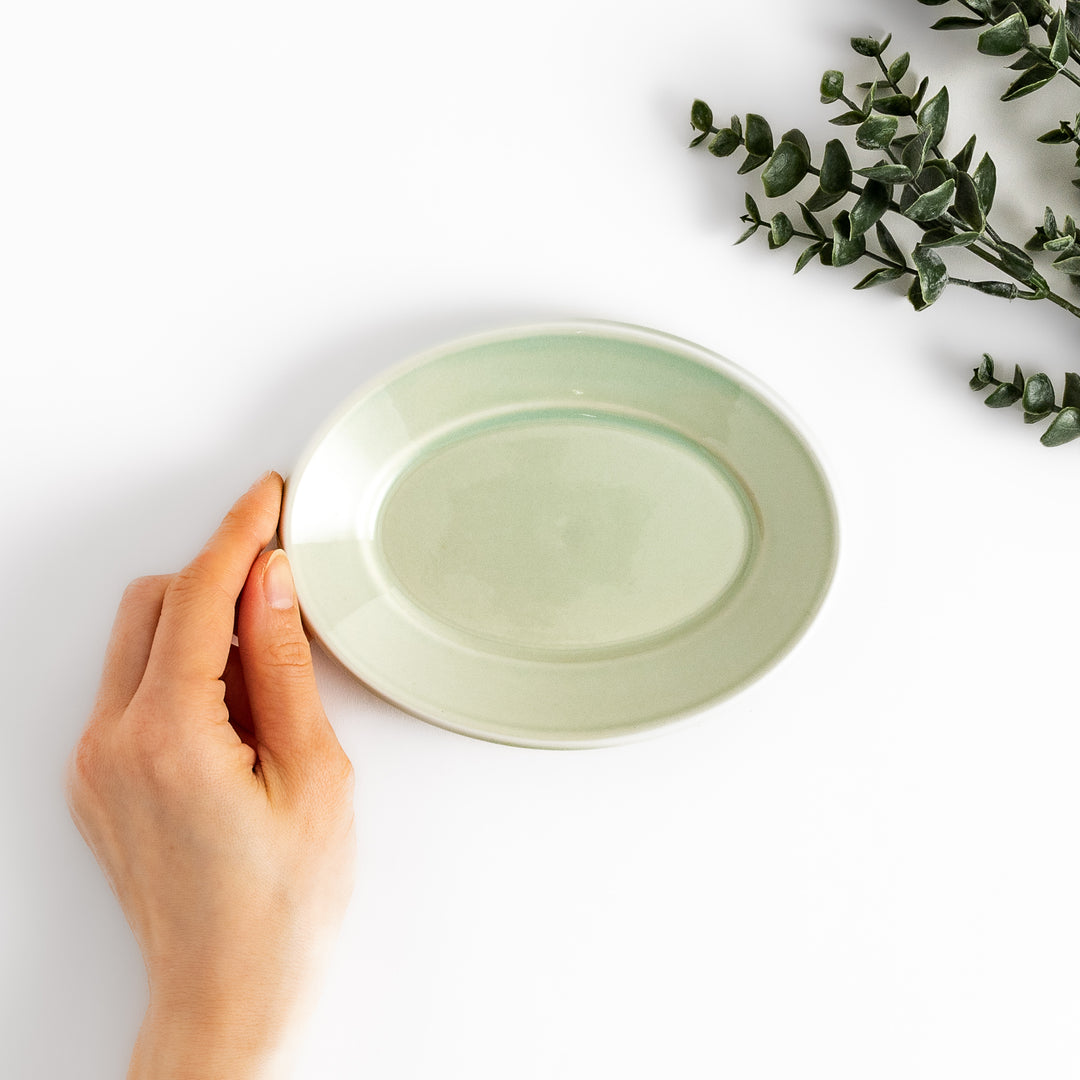 Durable and elegant green ceramic dessert plate, bringing a fresh touch to your table setting.