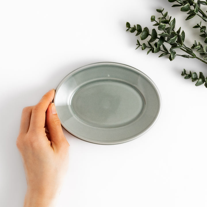 Durable and elegant gray ceramic dessert plate, offering a modern and sophisticated touch to your dining.