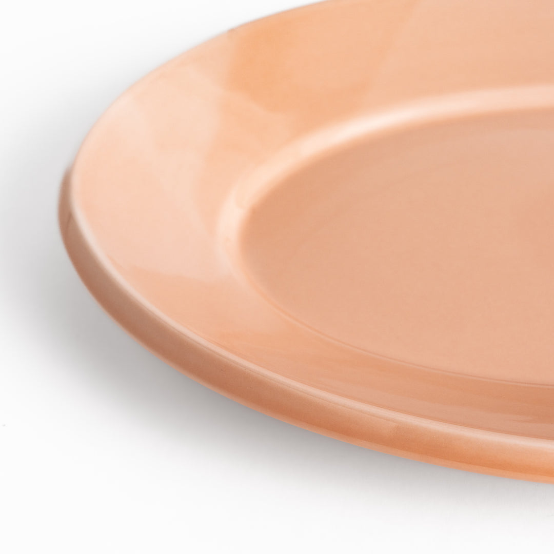 Durable and elegant pink ceramic dinner plate, adding a pop of color to your table setting.