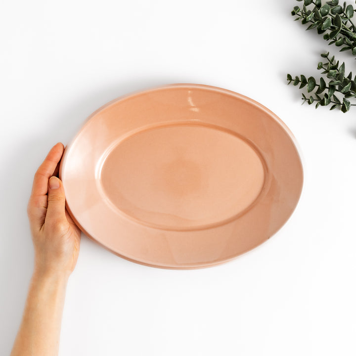 Durable and elegant pink ceramic dinner plate, adding a pop of color to your table setting.