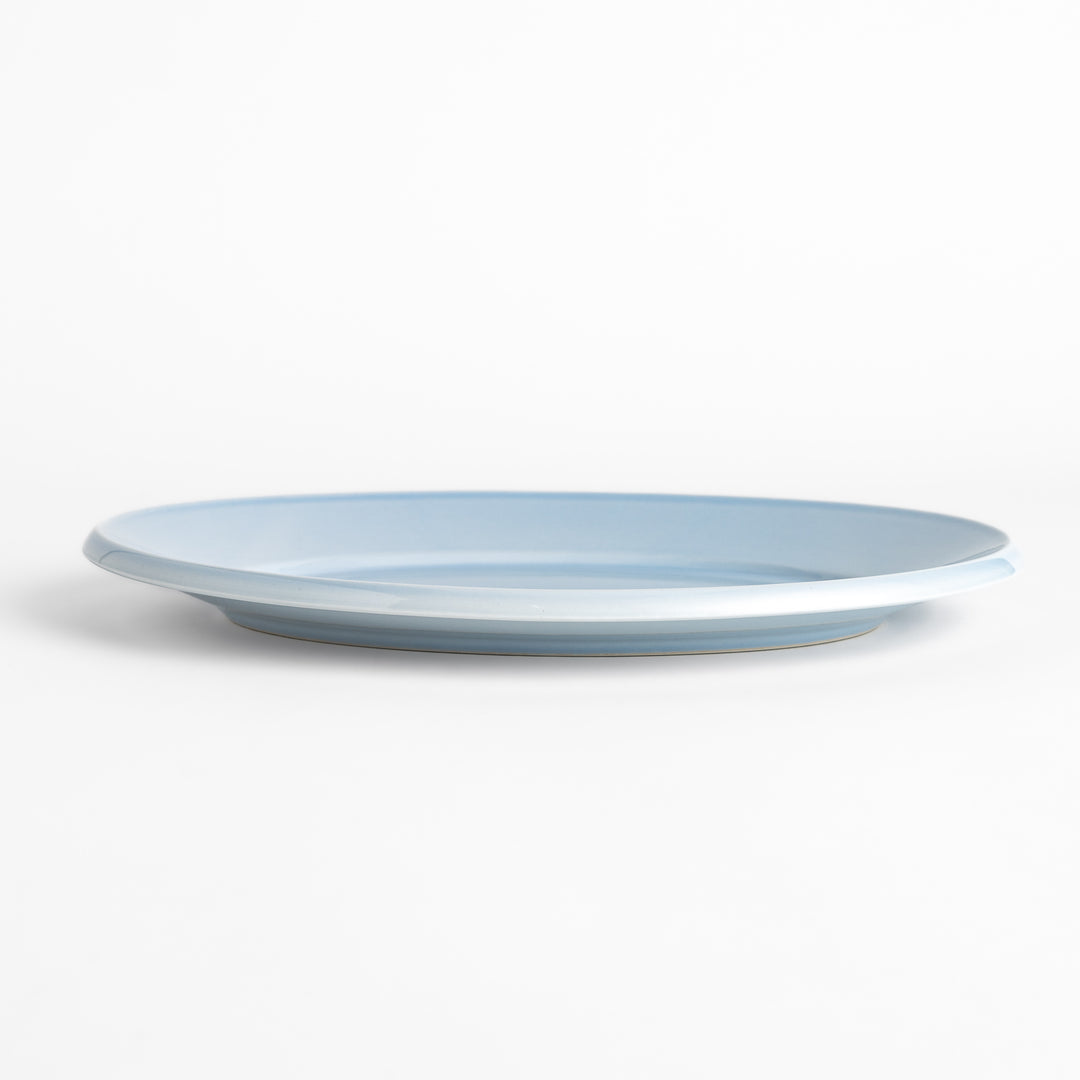 Durable and elegant blue ceramic dinner plate, adding a pop of color to your table setting.