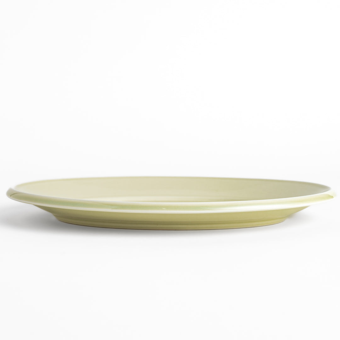 Durable and elegant green ceramic dinner plate, bringing a fresh touch to your table setting.