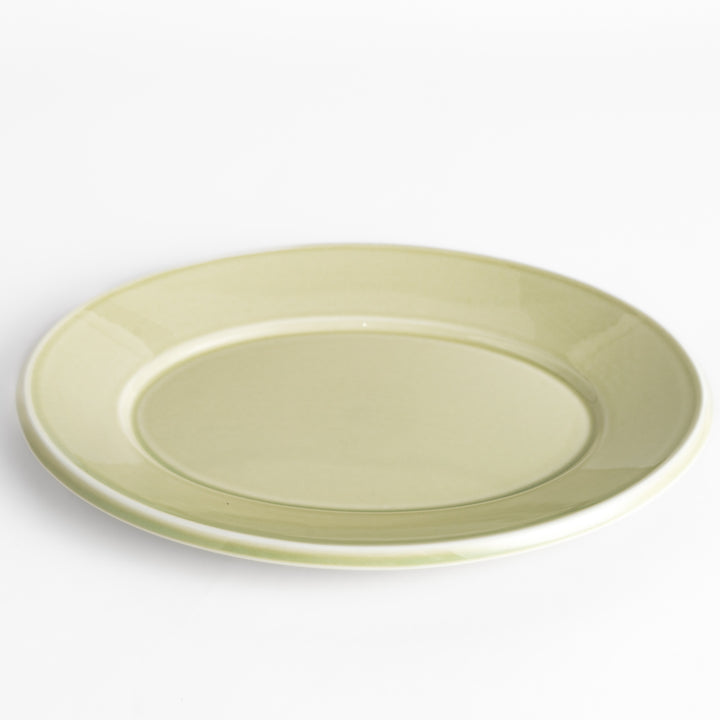 Durable and elegant green ceramic dinner plate, bringing a fresh touch to your table setting.