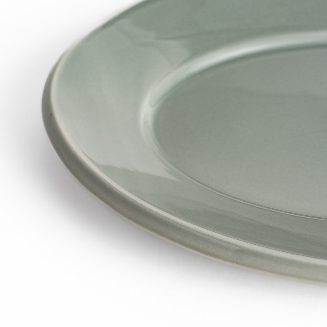 Durable and elegant gray ceramic dinner plate, offering a modern and sophisticated touch to your dining.