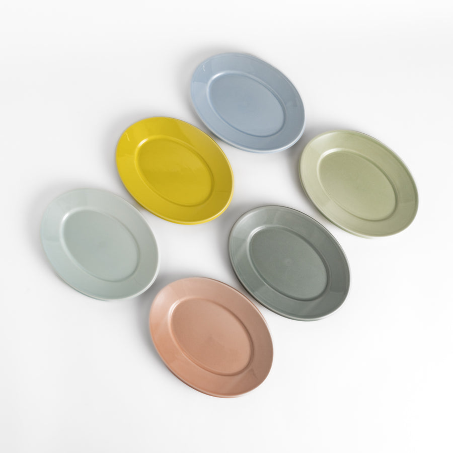 Beautiful pastel salad plates in a variety of soft hues, ideal for any occasion.