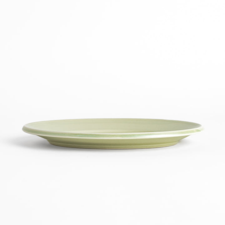 Durable and elegant green ceramic salade plate, bringing a fresh touch to your table setting.