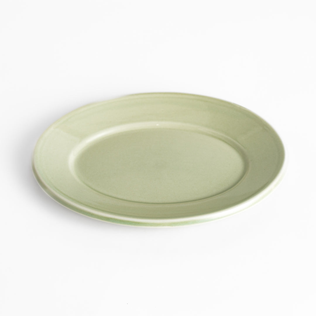 Durable and elegant green ceramic salade plate, bringing a fresh touch to your table setting.