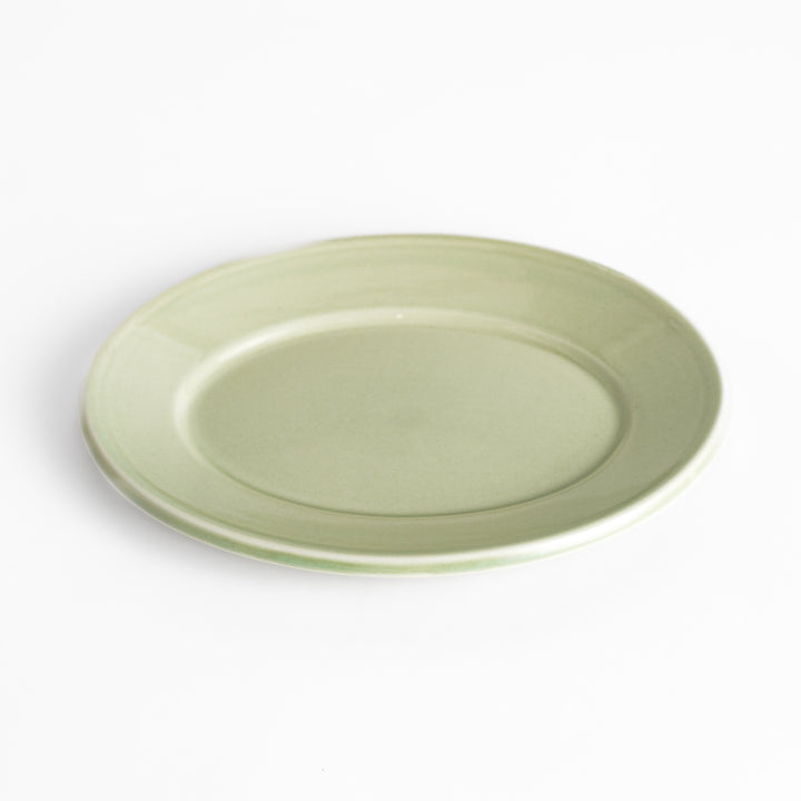 Durable and elegant green ceramic salade plate, bringing a fresh touch to your table setting.