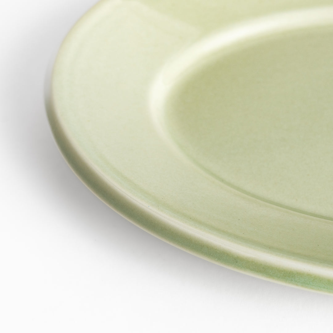 Durable and elegant green ceramic salade plate, bringing a fresh touch to your table setting.