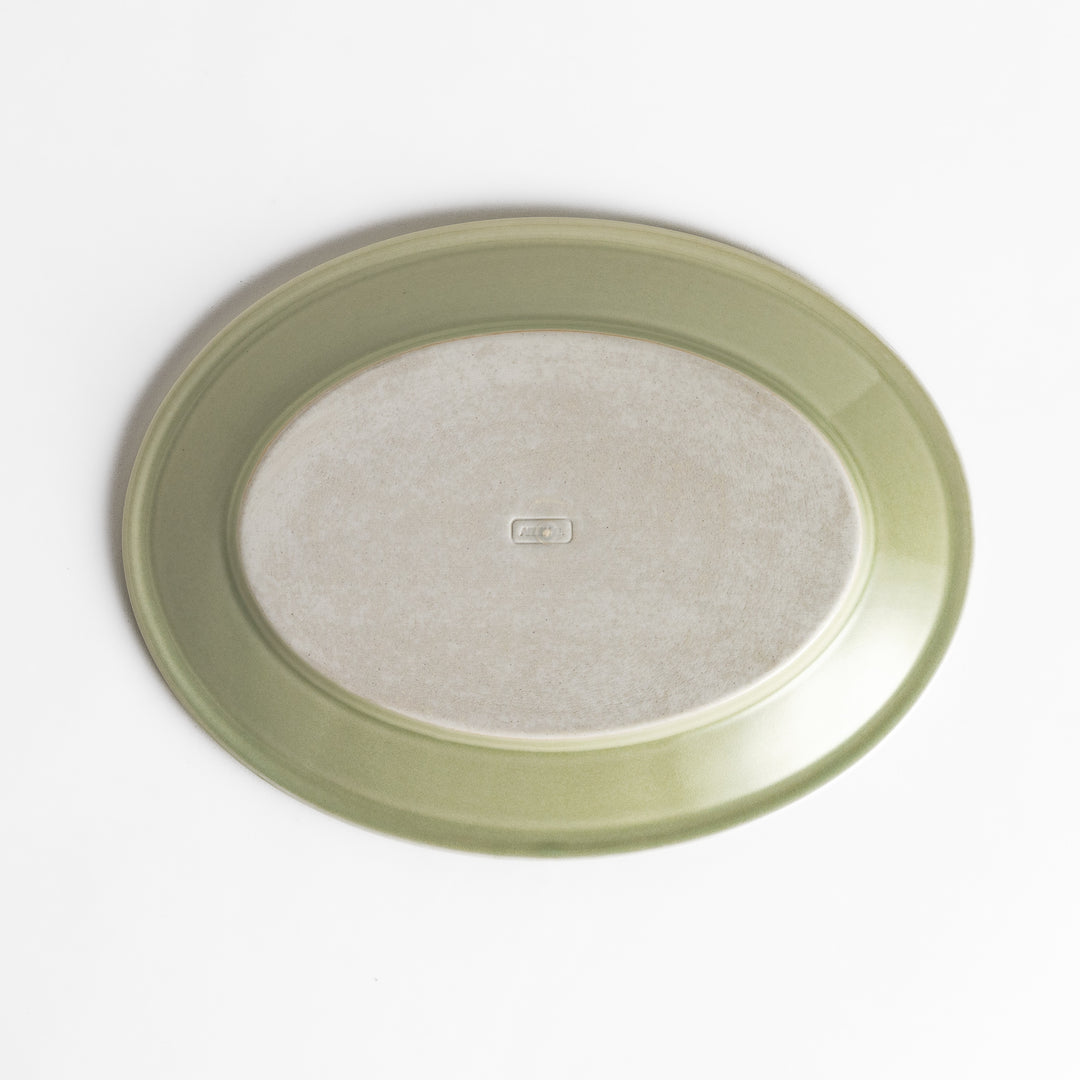 Durable and elegant green ceramic salade plate, bringing a fresh touch to your table setting.