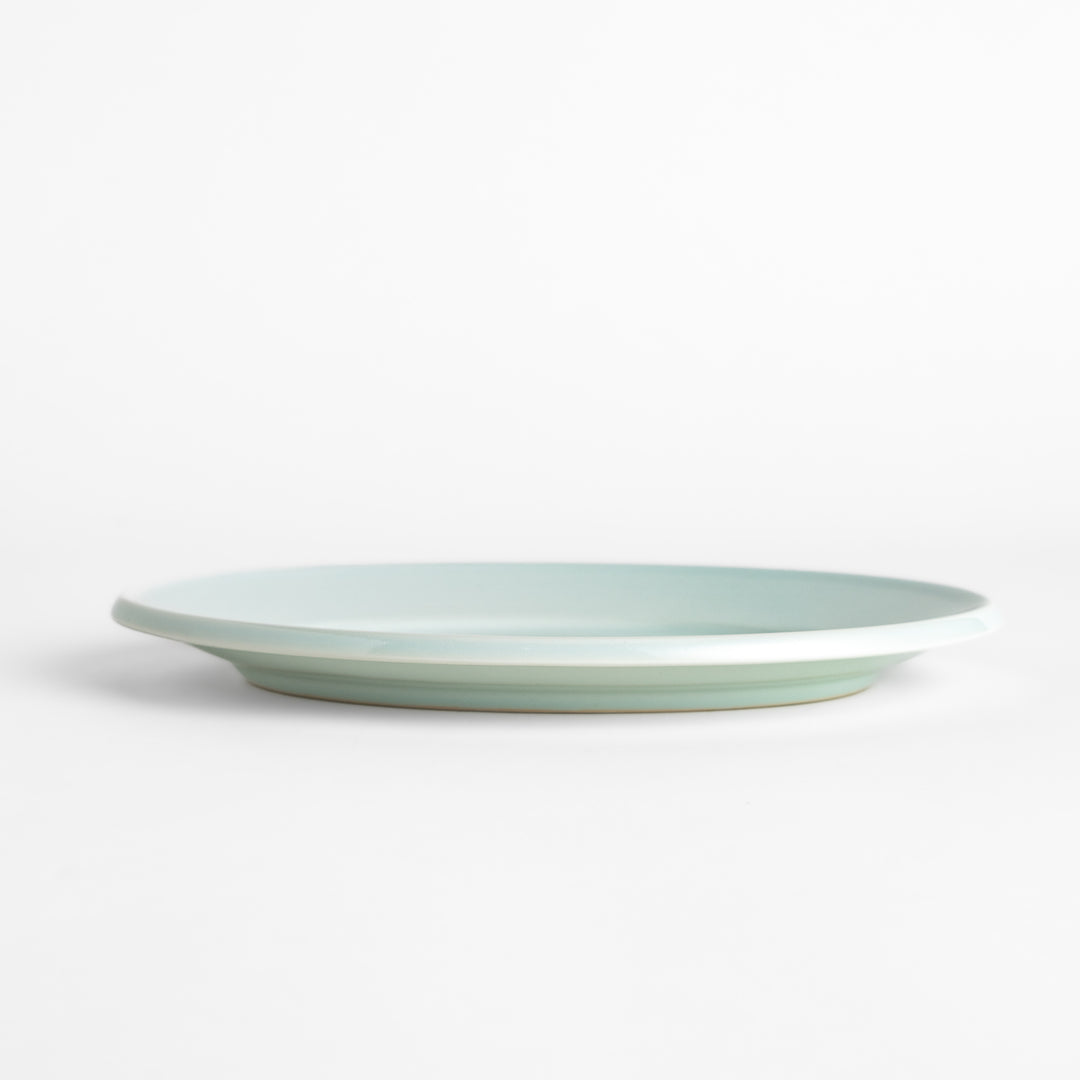 Durable and elegant white ceramic salade plate, a classic and versatile addition to any table.