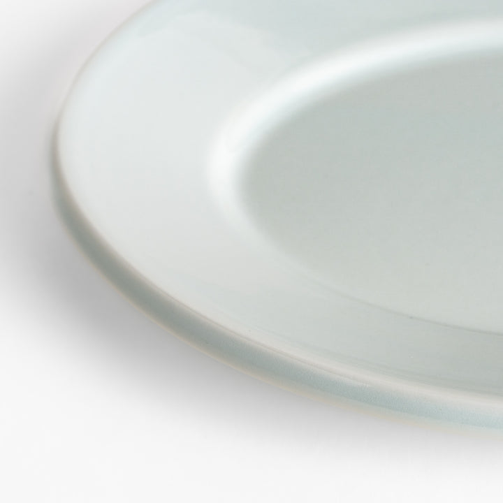 Durable and elegant white ceramic salade plate, a classic and versatile addition to any table.