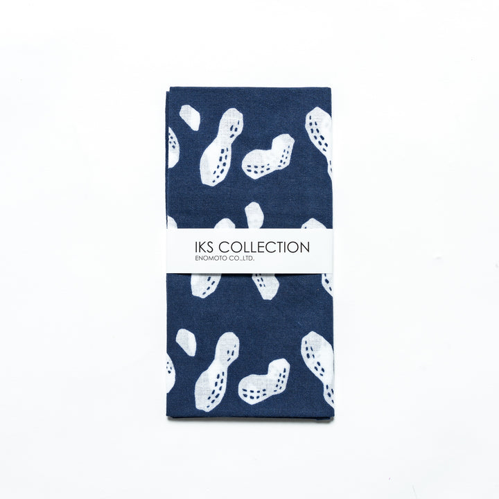 Navy hand towel with white peanut designs, folded with a branded sleeve.