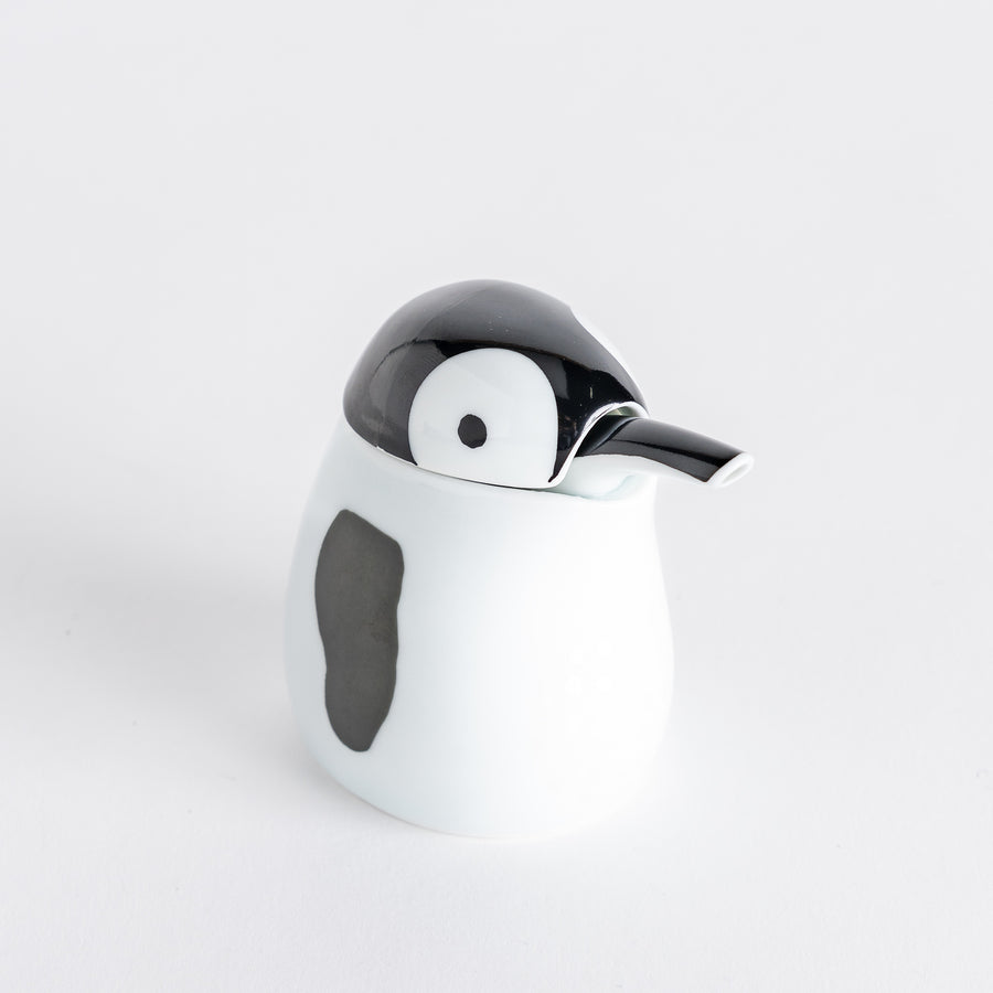 Penguin Soy Sauce Dispenser with a white body and black head, featuring a small spout.