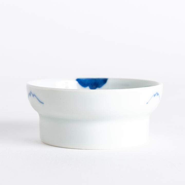 White raised sauce dish featuring a hand-painted blue peony flower.