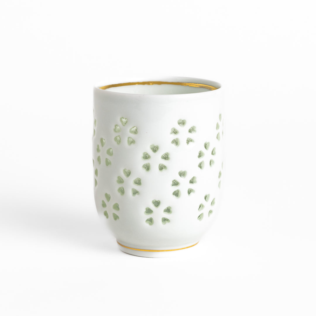 Elegant ceramic teacup featuring a subtle textured pattern and delicate gold trim, ideal for savoring your favorite brew.