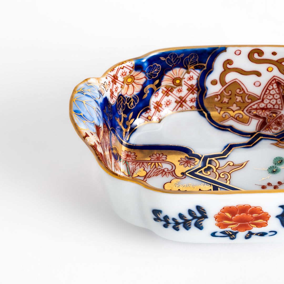 Vibrant Condiment Bowl with pine, bamboo, and plum motifs, accented by cranes and gold detailing, featuring a flared edge design.