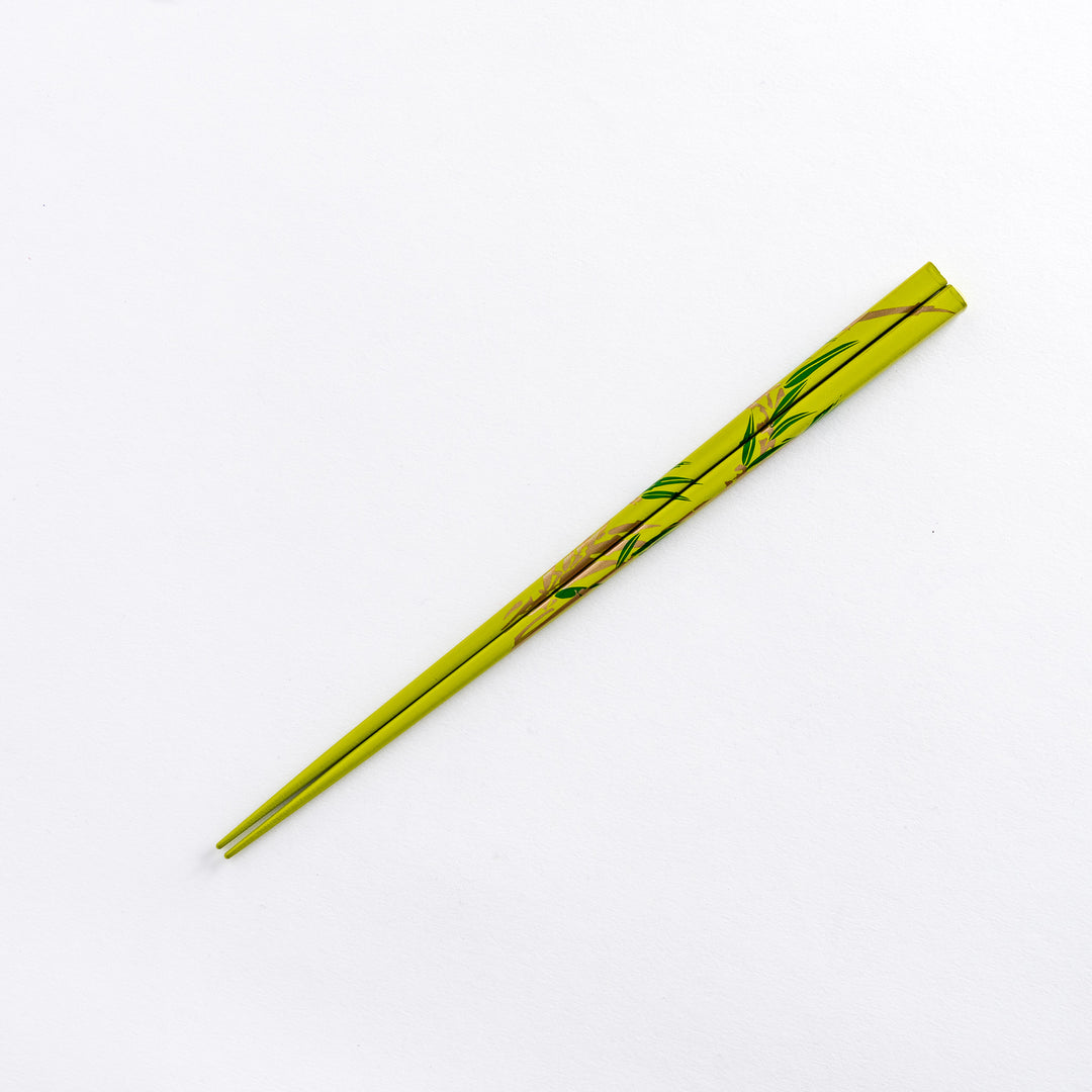 Green chopstick with bamboo pattern, showcasing the elegant design and craftsmanship.