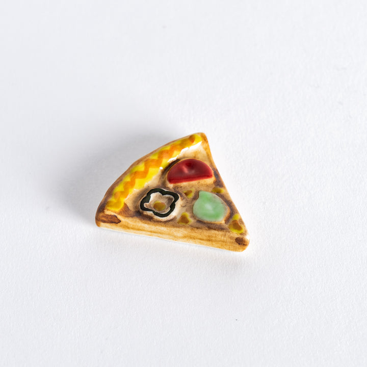 Pizza chopstick rest, featuring realistic details to resemble a slice of pizza with a colorful crust.