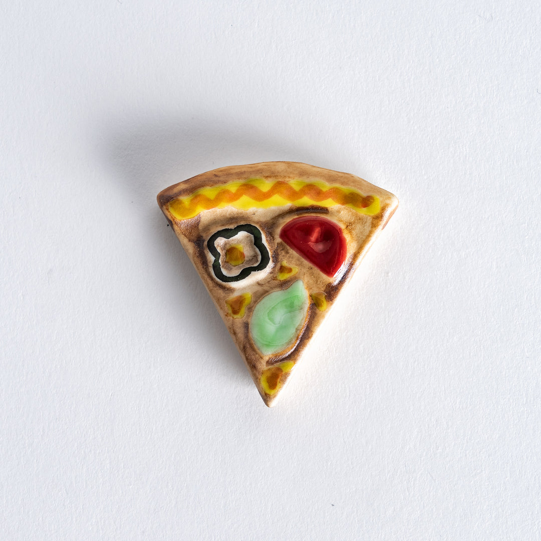 Top-down view of the pizza chopstick rest, emphasizing the circular and triangular design with realistic pizza details.