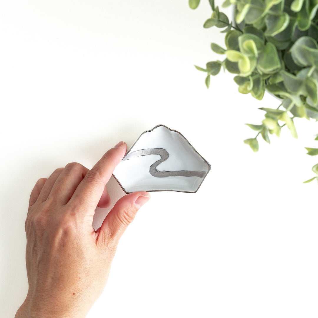 Mt. Fuji-shaped plate with a silver wave pattern on a white background.