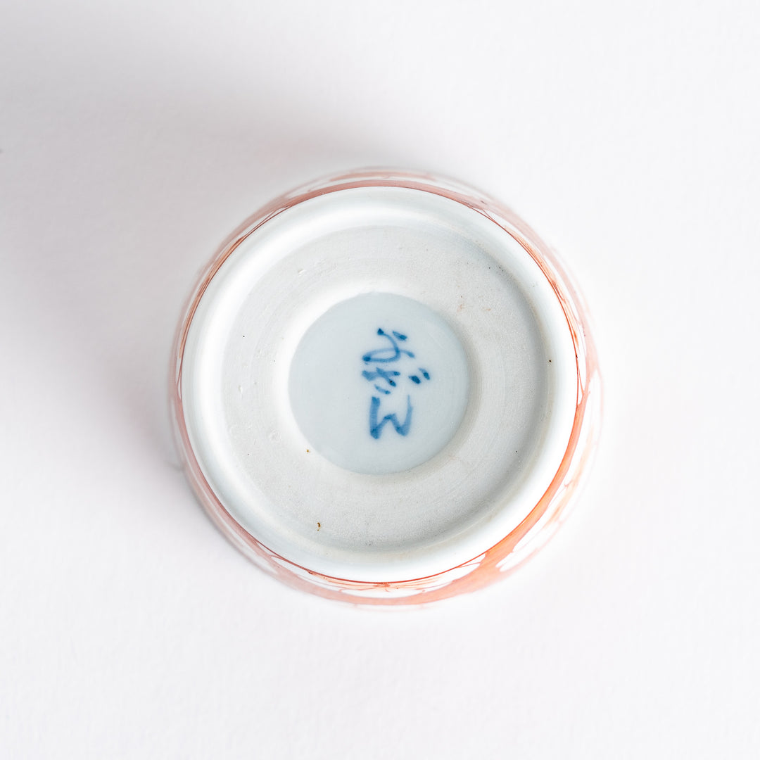 A small porcelain condiment bowl adorned with a blue floral pattern and soft brush strokes.