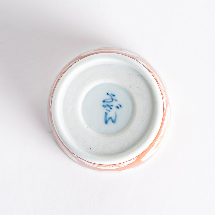 A small porcelain condiment bowl adorned with a blue floral pattern and soft brush strokes.