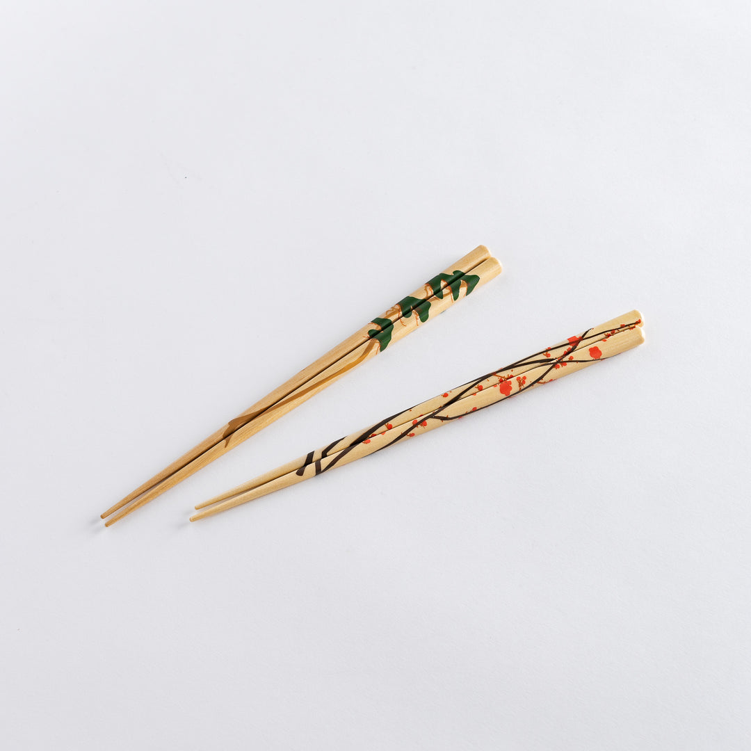 Two elegant chopstick rests with a translucent finish, featuring delicate swirls of beige and white patterns.