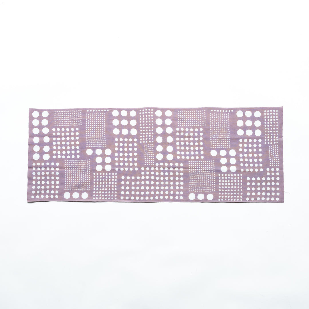 Purple gray polka dot tenugui hand towel laid flat, showing white dots arranged in square patterns.