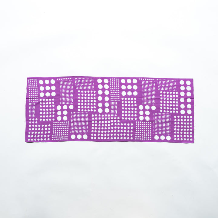 Purple polka dot tenugui hand towel laid flat, showcasing the precise white dot patterns.