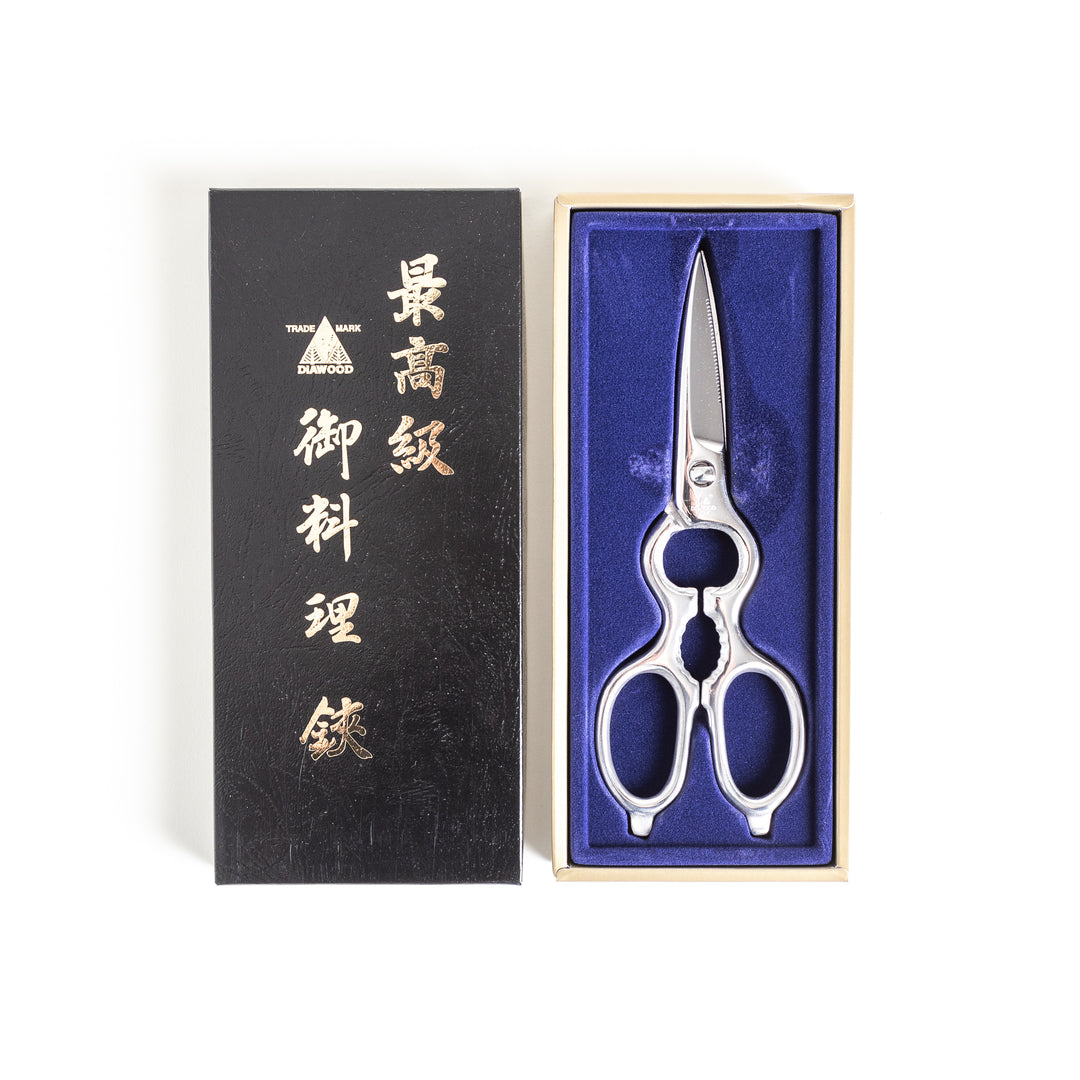 Premium Japanese pull-apart kitchen shears displayed in a black box lined with blue fabric, offering a luxurious and elegant presentation.