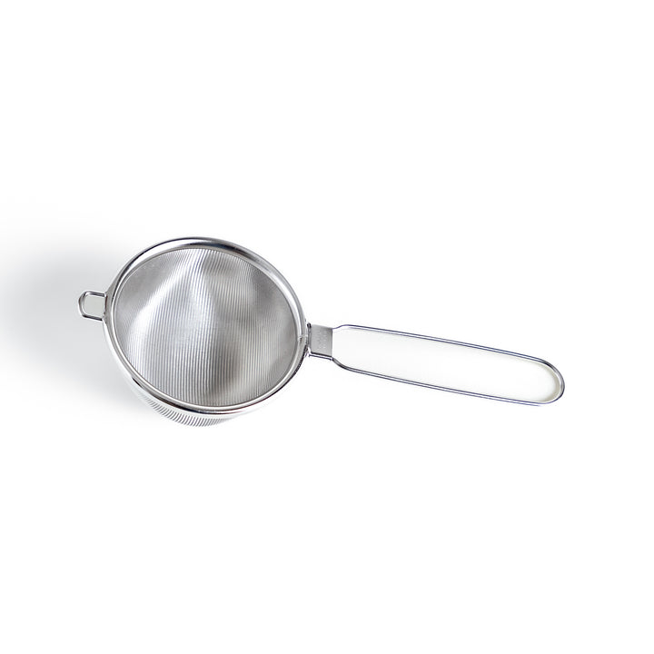 Stainless steel tea strainer with a fine mesh and a long handle, an essential kitchenware tool for brewing loose leaf tea.