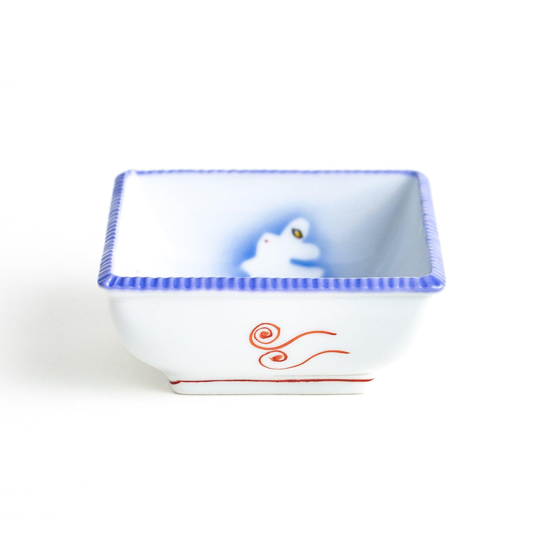 A square bowl featuring a rabbit and snowflake with a light blue rim.