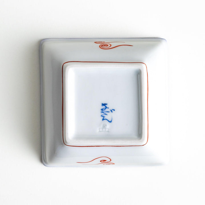 A square bowl featuring a rabbit and snowflake with a light blue rim.