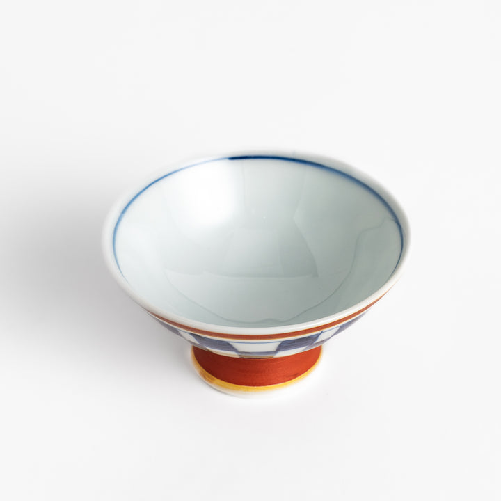 Elegant Japanese Sake Cup featuring a red and white design with gold accents, perfect for enjoying your favorite sake.