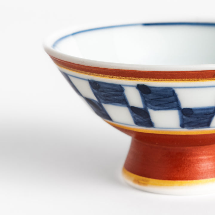 Elegant Japanese Sake Cup featuring a red and white design with gold accents, perfect for enjoying your favorite sake.